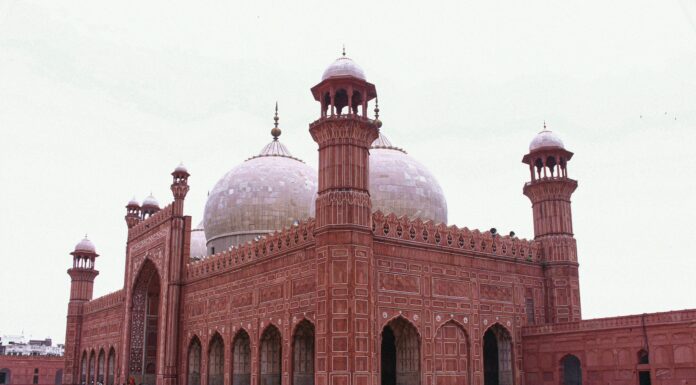 a large red brick building with a white dome