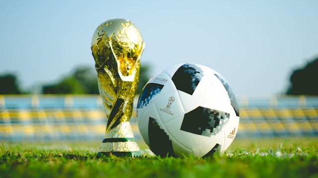 shot of a trophy and a football