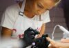 A girl applying nail polish