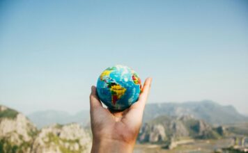 Best Travel agency in Karachi A person holding a small globe