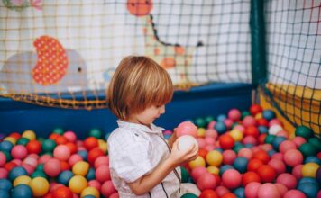 Best Places for Kids in Lahore to Visit This Weekend Child Boy Playing with Plastic Colorful Play Balls in Ball Pit
